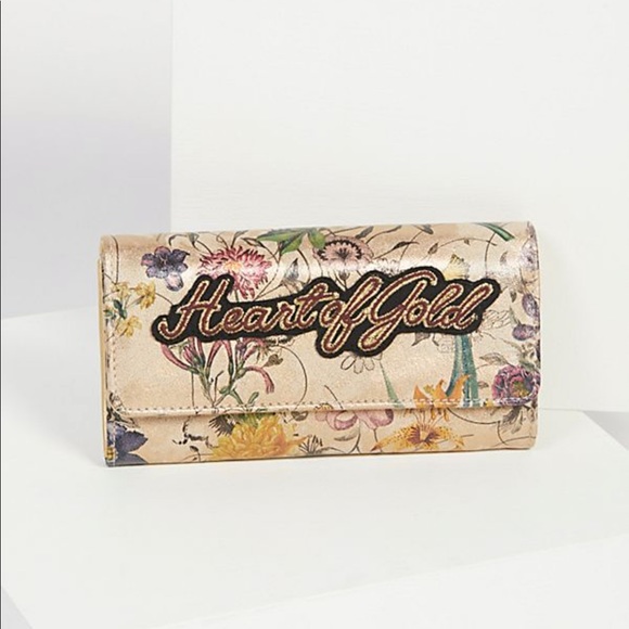 Free People Handbags - NWOT Free People ‘Heart of Gold’ floral wallet.